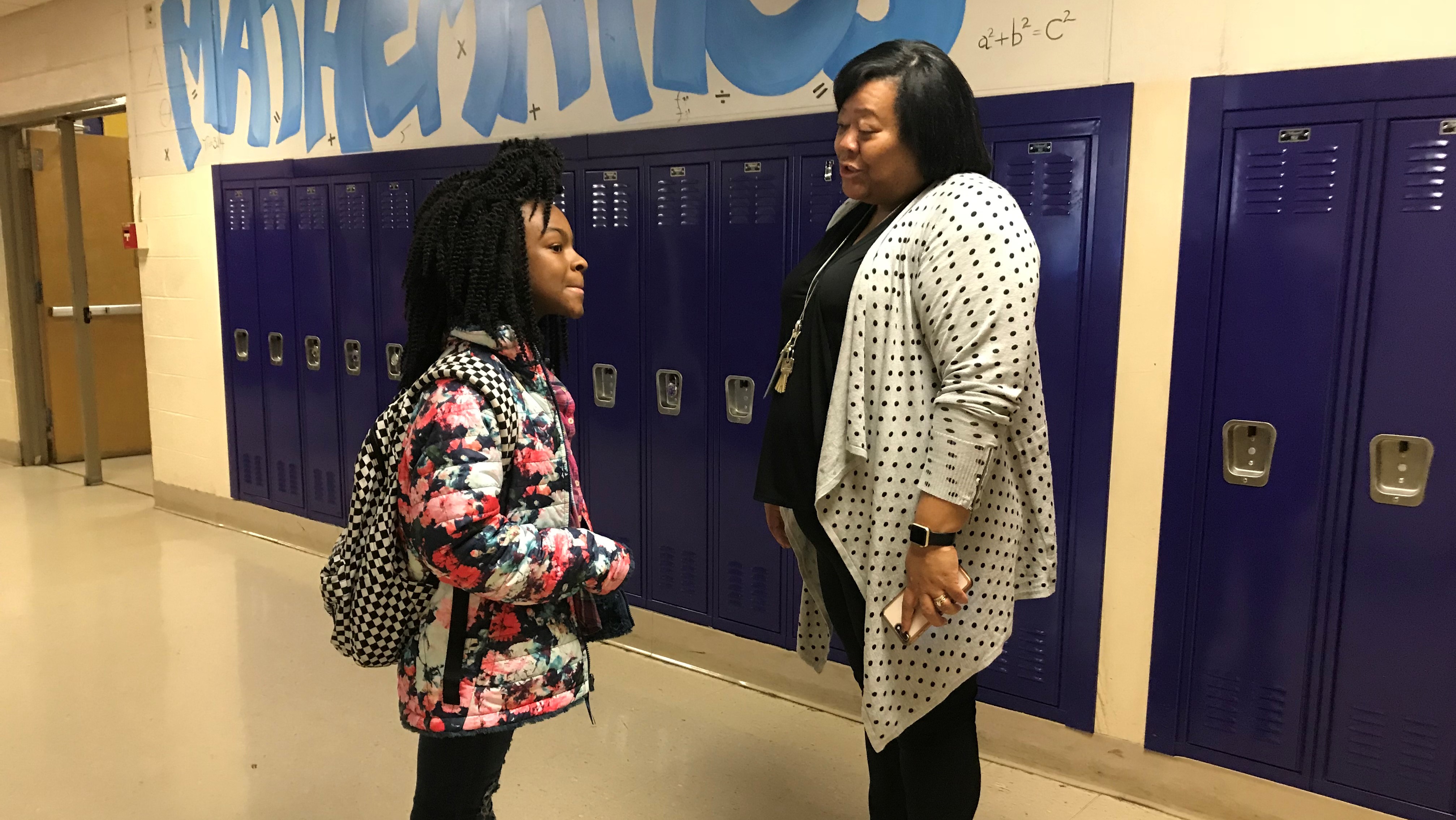 Vine Middle Magnet School principal Desiree Jones talks to a student after the school's advisory period on Dec. 5, 2018. 